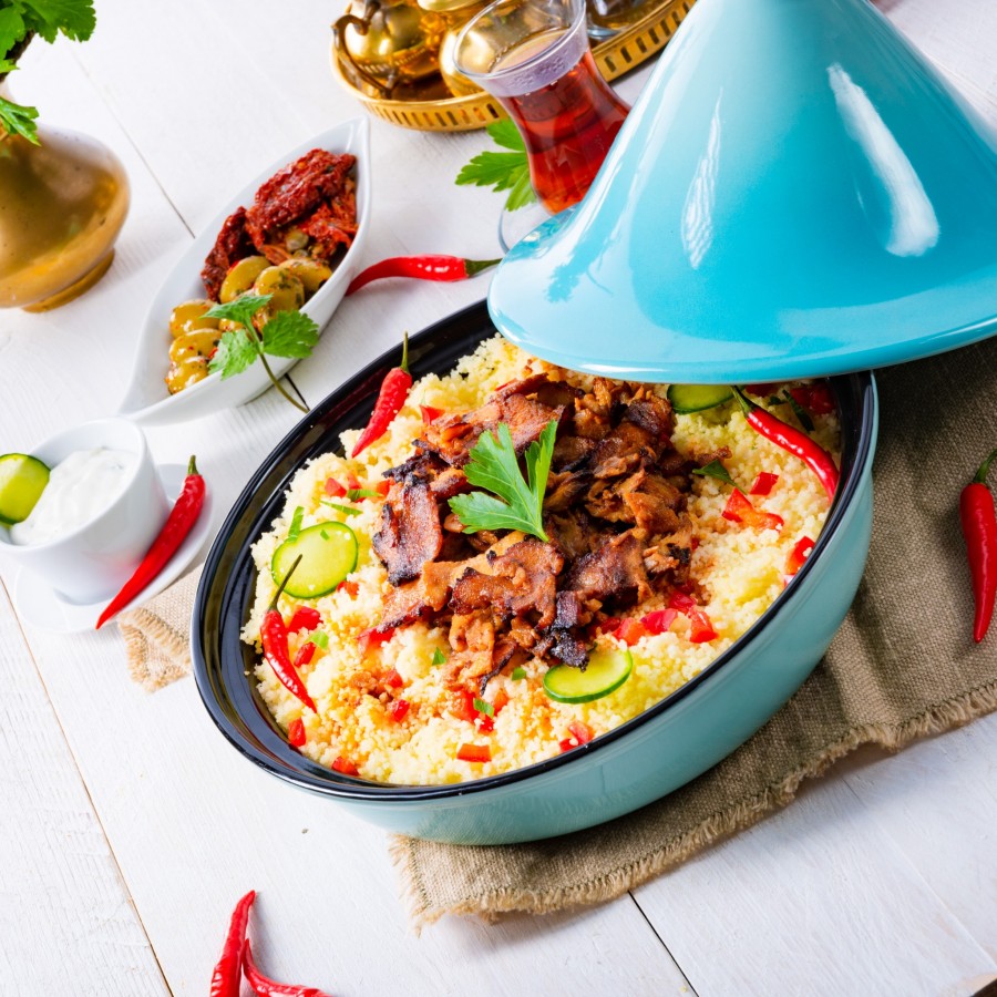 Quelle est l'origine des boulettes dans la cuisine tunisienne et leur importance dans le couscous ?